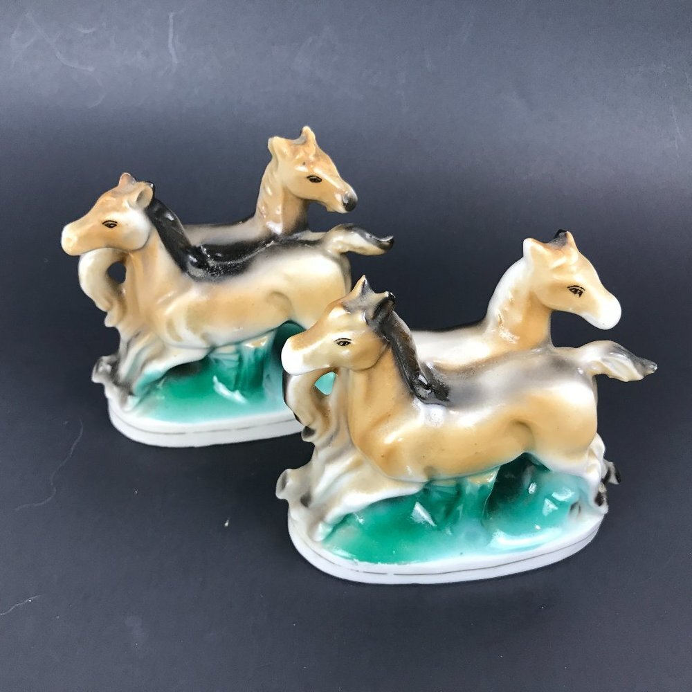 Two small antique horse figurines marked occupied Japan